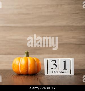 Happy Halloween day with pumpkin and 31 October calendar. Trick or Threat, Hello October, fall autumn, Festive, party and holiday concept Stock Photo