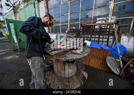 ZAPORIZHZHIA, UKRAINE - MAY 19, 2022 - A man works on the 2.5-tonne monument to the bulletproof vest, Zaporizhzhia, southeastern Ukraine.
