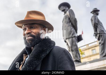 London, UK.  28 September 2022. Samson Kambalu at the unveiling of his work ‘Antelope’, the new Fourth Plinth artwork in Trafalgar Square.  The artwork restages a 1914 photograph of Baptist preacher and pan-Africanist John Chilembwe, and European missionary John Chorley as a sculpture. Chilembwe has his hat on, defying the colonial rule that forbade Africans from wearing hats in front of white people.  Credit: Stephen Chung / Alamy Live News Stock Photo