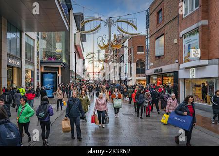 Dublin, November 2019 Henry Street decorated for Christmas with crowds of people on shopping spree. The Spire on OConnell street visible in background Stock Photo