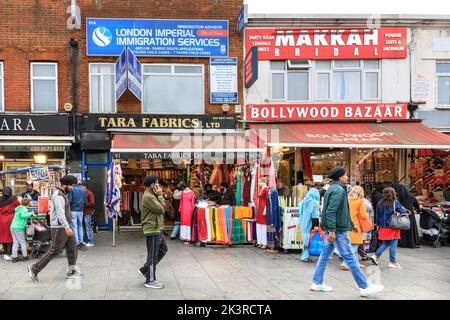 Punjabi, Indian and Asian shops and people shopping in Southall High Street, Southall, West London, England, UK Stock Photo