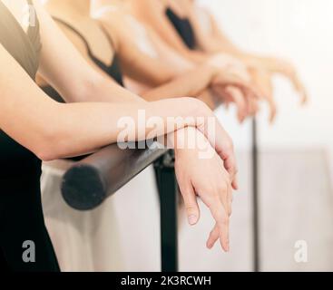 Ballet, art and woman hands on a barre at a dance academy doing routine training for concert. Closeup of elegant, classical and artistic dancers Stock Photo