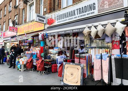 Punjabi, Indian and Asian shops and people shopping in Southall High Street, Southall, West London, England, UK Stock Photo