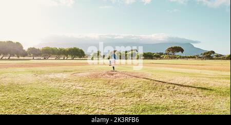 Panoramic of pitcher on field for a game of baseball, ready to pitch and throw the ball. Baseball player standing alone on pitchers mound on baseball Stock Photo