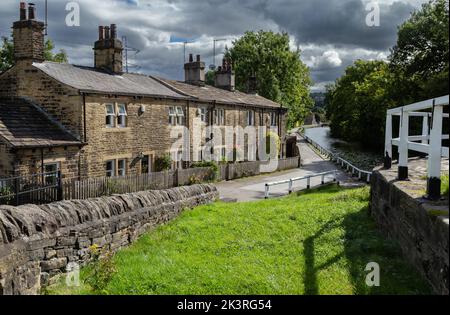 Dobson Lock Cottages next to the Leeds Liverpool Canal at Apperley Bridge, West Yorkshire. These former canal company cottages are Grade ll listed. Stock Photo