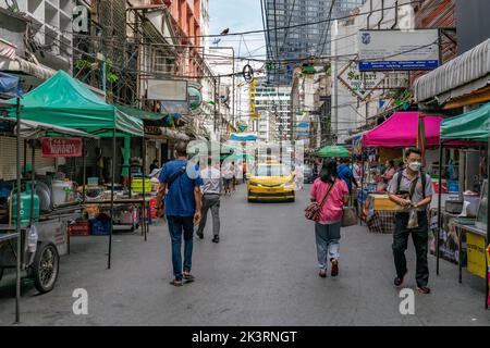 Patpong, during the daytime, is an open-air street food bazaar. Night time will transform into nightlife and red light district in Bangkok, Thailand Stock Photo