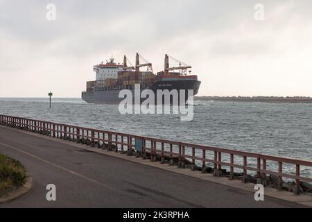 Container ship entering Durban Harbor on a Spring morning in 2022. Stock Photo