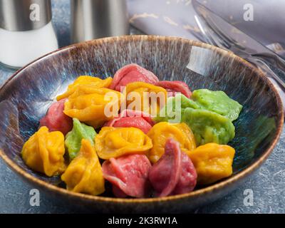 fashion trend tasty colored dumplings with universal filling Stock Photo