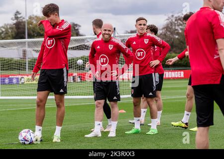 PONTYCLUN, WALES - 19 SEPTEMBER 2022: Wales' Jonny Williams  and Wales' Luke Harris  during a training session at the vale resort ahead of the league Stock Photo