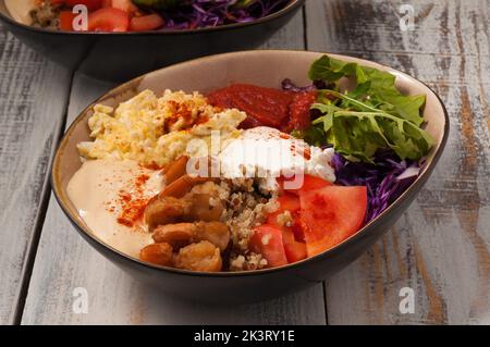 tasty poke with vegetables, egg scramble, cottage cheese and shrimp Stock Photo