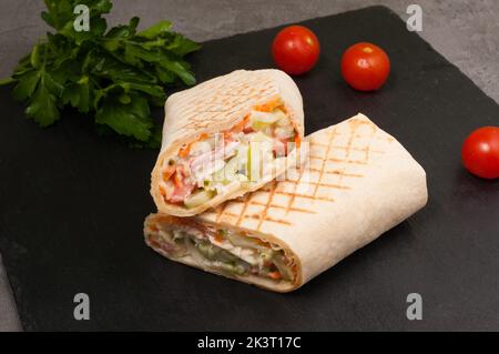 tasty vegetarian Shawarma with vegetables, toasted on the grill Stock Photo