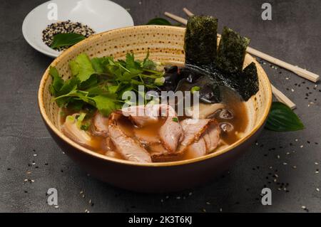 tasty asian ramen soup with beef and mushrooms Stock Photo