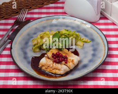 tasty white cod fillet in teriyaki sauce with zucchini Stock Photo