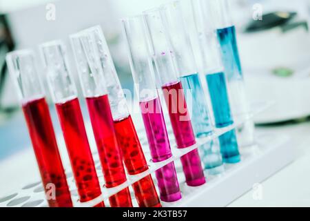 Close up view of set of test flasks with color liquids at laboratory Stock Photo
