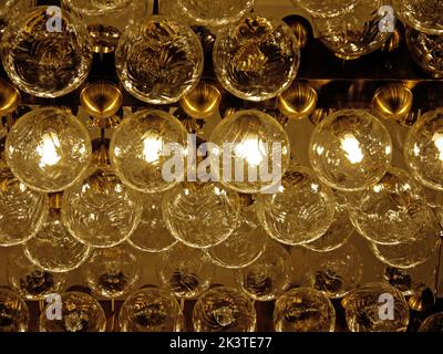 Lot of bulbs organized in rows on a ceiling Stock Photo