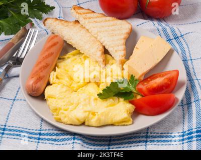 tasty english breakfast with scramble and toast in the cafe Stock Photo