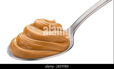 Peanut butter in spoon isolated on white background Stock Photo