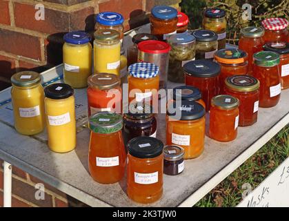 A table of various home made jams, chutneys and preserves, for sale for charity, chutney, prolific, Stockton Lane, Warrington, Cheshire, England, WA4 Stock Photo