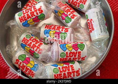A tin of Love Hearts, limited edition, valentines day romantic confectionary from  Swizzels Matlow in New Mills, Derbyshire, England, UK Stock Photo