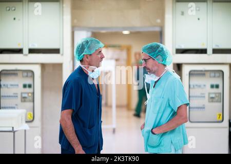 Two surgeons talking in hospital Stock Photo