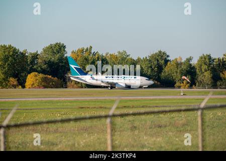 A Westjet commercial jet aircraft taxiing at the Ottawa McDonald Cartier Airport, Ottawa, Ontario, Canada Stock Photo