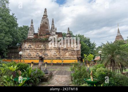 Landscape view of landmark ancient Wat Jed Yod or Wat Chet Yot buddhist temple, Chiang Mai, Thailand, inspired by Mahabodhi temple in Bodhgaya, India Stock Photo