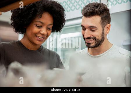 Bakery coworkers using digital tablet Stock Photo