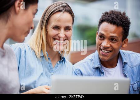 Small business coworkers having a meeting outdoors Stock Photo