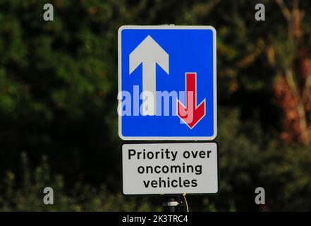 Priority over oncoming vehicles road sign Stock Photo