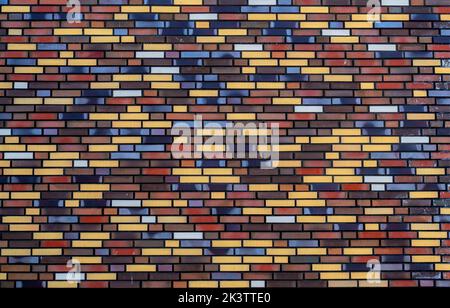 Background from wall of multicolored bricks Stock Photo