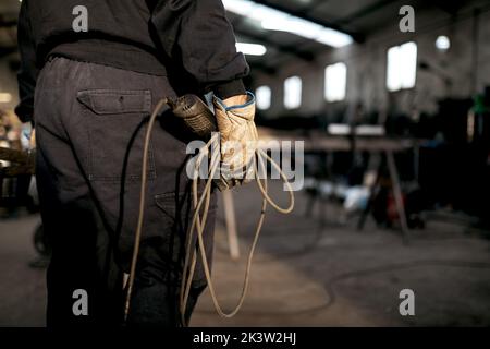 Male welder working hard in workshop Stock Photo