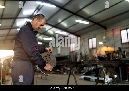 Male welder working hard in workshop Stock Photo
