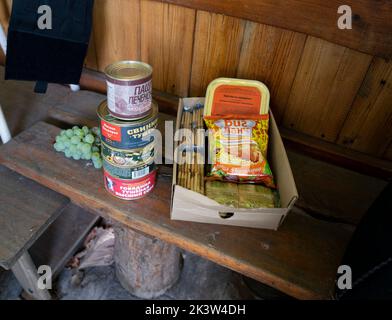 Russian food is rationed to residents in Izyum during occupation. Food including canned corned beef, pig stew, crackers, chicken instant noodles. However, Illia said it was in limited amount that they would have to buy extra, sustain from their produce in the garden or have to starve. Ukrainian troops liberated Izyum and other key strategic areas in Kharkiv region three weeks ago. Residents slowly returning to normality despite signs of Russian occupants still in the city and the city remains out of water, electricity and gas. Stock Photo