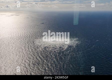 Aerial photo released by the Danish Ministry of Defense on Sept. 27, 2022 shows the Nord Stream gas pipeline leak site. Measuring stations in Sweden registered strong underwater explosions in the same area of sea as the gas leaks that occurred in the Nord Stream 1 and 2 pipelines on Monday, Swedish television (SVT) reported on Tuesday. Credit: Xinhua/Alamy Live News Stock Photo