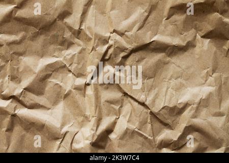 Crumpled old brown craft paper background texture Stock Photo
