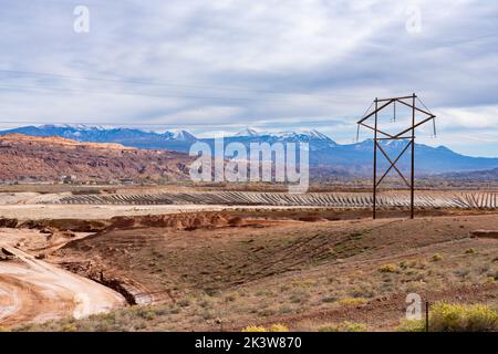 The Moab UMTRA Project removing radioactive tailings from site of former uranium processing mill in Moab, Utah.  The snow-capped La Sal Mountains are Stock Photo