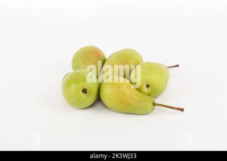 Ripen green pears isolated on white. Five ripe pears with isolated on white. Stock Photo