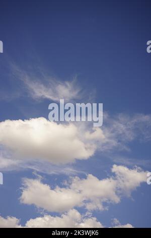 Summer background blue sky with white fluffy clouds. Stock Photo