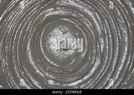 Wet mortar cement paste mixed in bucket, closeup detail from above Stock Photo