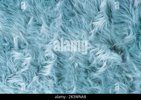 Trendy brown artificial fur texture. Fur pattern top view. Brown fur  background. Texture of beige shaggy fur. Wool texture. Flaffy sheepskin  close up Stock Photo