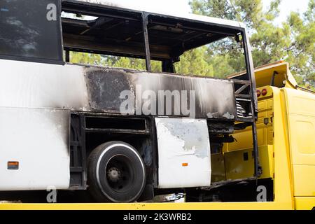 A bus with a burnt backside. Stock Photo