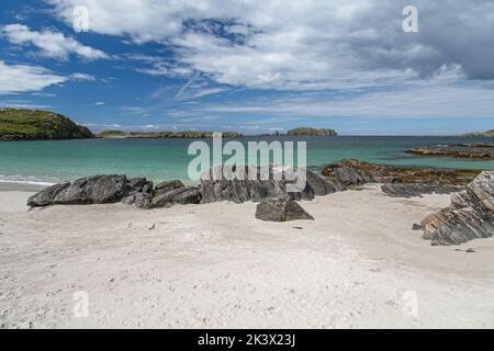 Rocks on White Sand and Turquoise Sea at Bosta Beach, Bernera, Great Bernera, Hebrides, Outer Hebrides, Western Isles, Scotland, United Kingdom Stock Photo