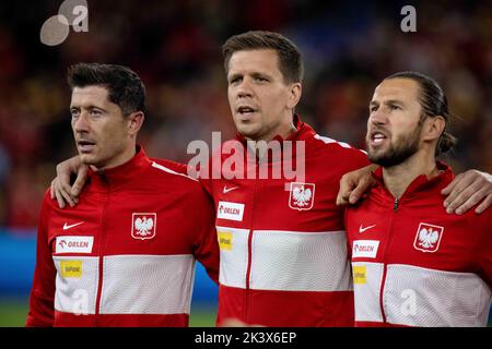 CARDIFF, WALES - SEPTEMBER 25: Robert Lewandowski, Wojciech Szczesny and Grzegorz Krychowiak of Poland sing national anthems during the UEFA Nations L Stock Photo