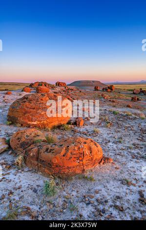 Last light of the day on the spherical sandstone boulders at thme Red Rock Coulee Natural Area, in southern Alberta Stock Photo