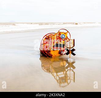 A large buoy buried in the sand at the beach after  typhoon Noru went through central Vietnam. Stock Photo