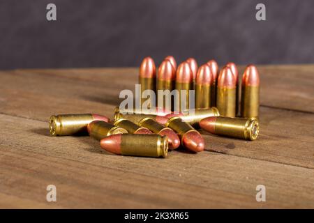 9 milimeter ammunition laying on the table Stock Photo