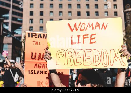 Vancouver, Canada - September 25,2022: Huge rally in support of Iranian protests in front of Vancouver Art Gallery. Woman with a sign Woman Life Freed Stock Photo