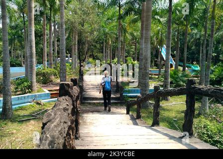 A Woman walking around abandoned waterpark in Hue, Vietnam. Stock Photo