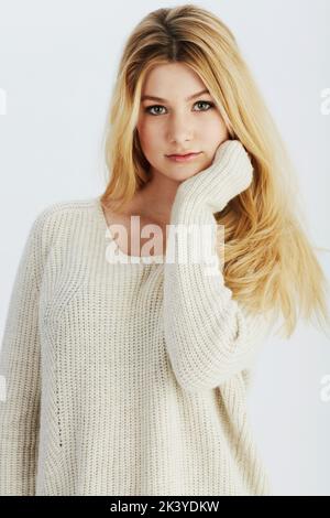 Casually confident. Studio portrait of a casually dressed young woman. Stock Photo