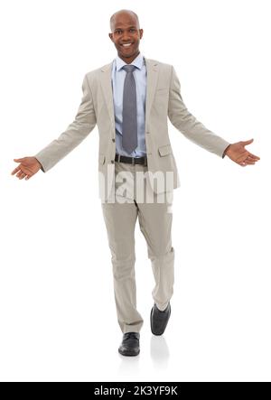 He knows how to operate in the business world. A handsome african american businessman isolated on a white background and shrugging. Stock Photo